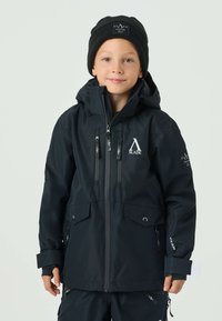 Black waterproof jacket featuring a raised collar, multiple zippered pockets, adjustable cuffs, and a logo on the chest.