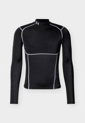 Camiseta deportiva negra de manga larga ajustada con cuello alto y costuras blancas en contraste, con un pequeño logo blanco en el cuello.
