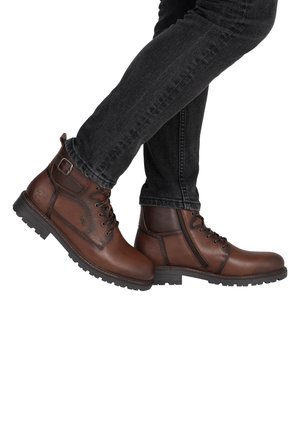 Brown leather ankle boots feature a round toe, lace-up front, side zipper, and textured finish. Rubber sole with traction pattern.