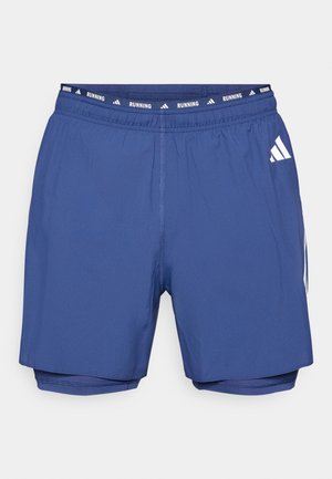 Blå løpetights med elastisk midjebånd merket "RUNNING." Har innerfor, glatt tekstur og hvit aksentlogo på siden.