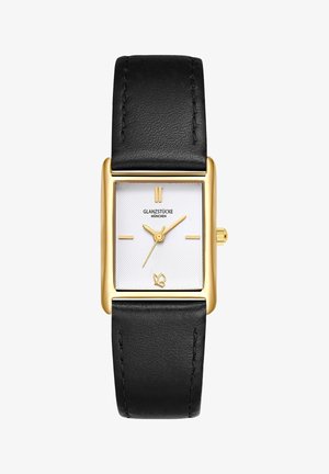 Obdĺžnikové zlaté hodinky s textúrovaným bielym ciferníkom, čiernym koženým remienkom a minimalistickými zlatými značkami. Na spodnej strane sa nachádza malé logo.