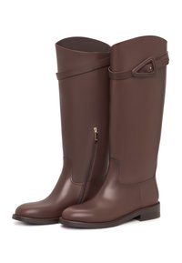 Brown leather knee-high boots with a smooth texture, side zipper, and a decorative strap with a triangular accent near the top.