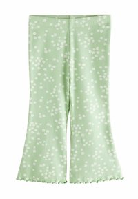 Groene geribbelde uitlopende legging met een wit bloemenpatroon, voorzien van een gerimpelde zoom en een aansluitende tailleband.