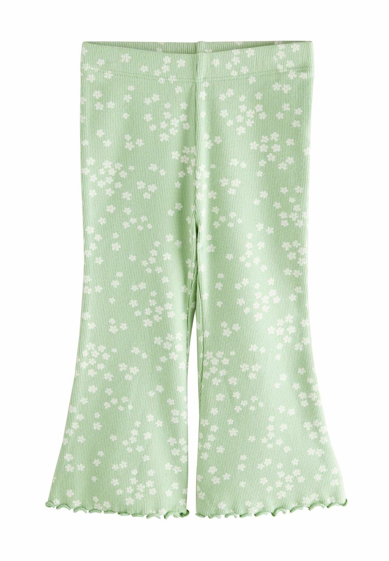 Groene geribbelde uitlopende legging met een wit bloemenpatroon, voorzien van een gerimpelde zoom en een aansluitende tailleband.