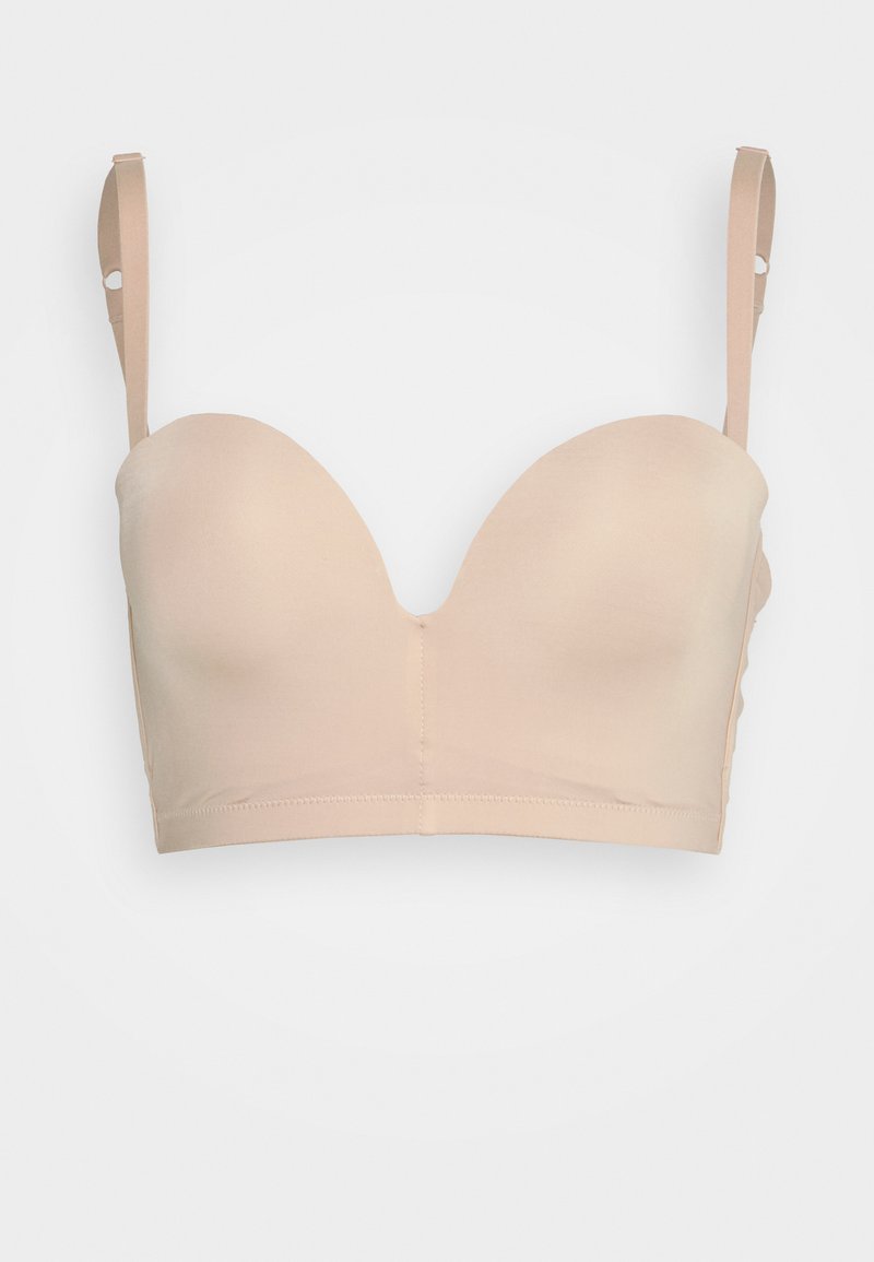Μπέζ, μαλακό bralette με λείες, χωρίς ραφές cups, ρυθμιζόμενους ιμάντες και φαρδιά ζώνη; φτιαγμένο από μαλακό, ελαστικό ύφασμα.