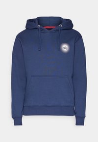Sweat-shirt à capuche bleu marine avec poche kangourou devant, capuche avec cordon de serrage, poignets et ourlet côtelés, et petit logo circulaire blanc sur le côté gauche de la poitrine.
