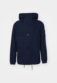Navy blue windbreaker jacket with a hood, four front pockets, button closures, and adjustable drawstring at the waist. Lightweight fabric.