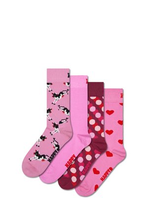 Vier Paar Crew-Socken: rosa mit schwarz-weißen Kühen, einfarbig rosa, kastanienbraun mit Punkten und rosa mit roten Herzen. Roter "HAPPY"-Text.