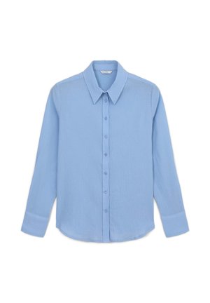 Light blue long-sleeve button-up shirt with a classic collar, front buttons, and a textured fabric. Features angled shoulder seams and cuffs.