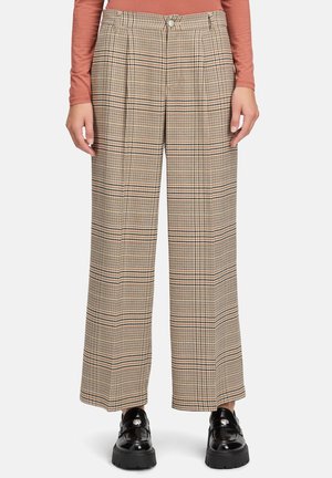 Beige karierten Hosen mit weitem Bein, die Falten, einen knöpfbaren Bund und einen strukturierten Stoff aufweisen. Akzente in Schwarz und Rosa im Muster.