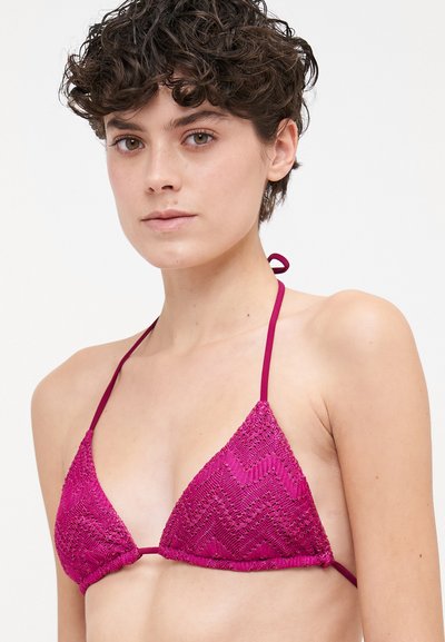 Triangle bikini top in deep pink, featuring a textured zigzag pattern, thin adjustable straps, and a simple tie closure at the back.