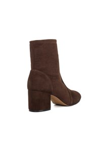 Brown suede ankle boot with a square toe, tapered upper, and a chunky heel. The sole is lightly textured for grip and stability.