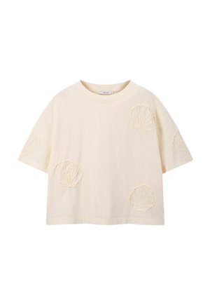 T-shirt en coton crème à manches courtes avec des motifs de coquillages brodés à divers endroits. Encolure arrondie, coupe décontractée et texture douce.
