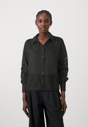 Dark green, button-up blouse with a textured floral pattern, featuring a collar and long sleeves gathered at the cuffs.