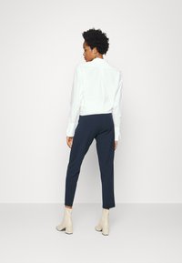 JDY JDYCATIA NEW ANKLE PANT - Calças - black iris