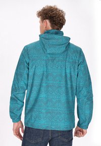 Türkise Jacke mit einem komplexen geometrischen Muster, aus leichtem Material, mit Kapuze und elastischen Bündchen.