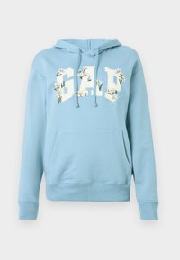 Light blue hoodie with front kangaroo pocket, drawstrings, and "GAP" text embellished with white daisy flowers on the chest.