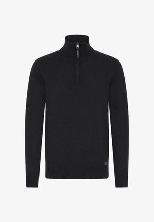 Mustem sviiter kõrge kaeluse ja lühi tõmblukuga. Omab pikki varrukasid ja soonikkoes alumist serva. Valmistatud pehmest kudumist.