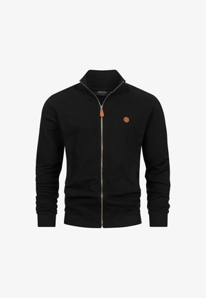 Black zip-up jacket with a ribbed texture, tall collar, and leather accent detail. Features a circular logo on the chest.
