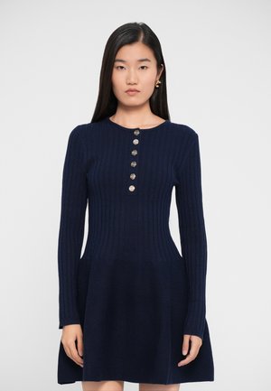Navy blue ribbed knit dress with long sleeves, buttoned front placket, and flared skirt; smooth texture and fitted bodice.