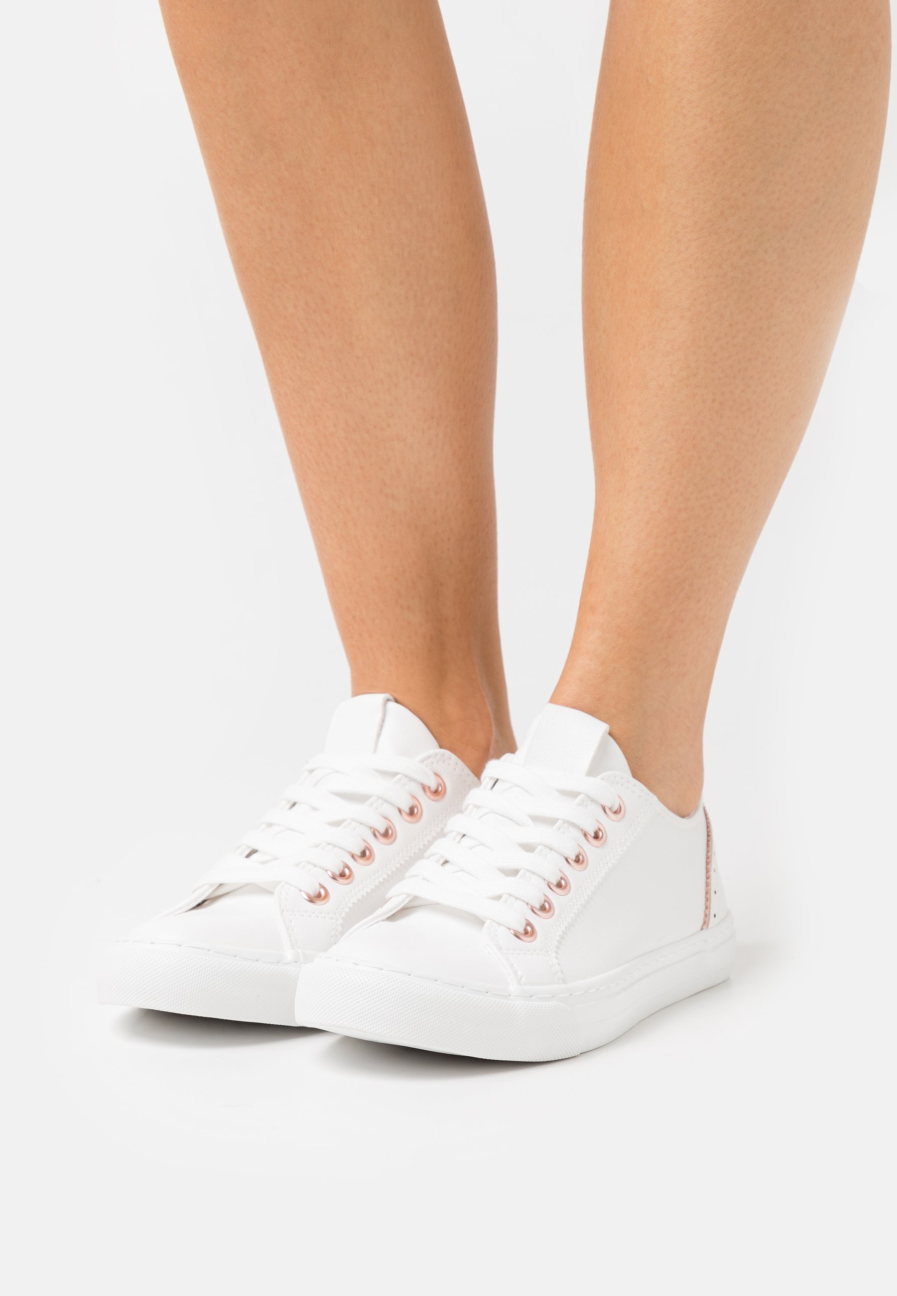 white and rose gold trainers