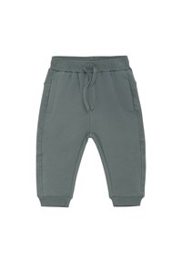 Ljusgrågröna sweatpants med elastisk midja, dragsko och sidofickor. Mudddetaljer vid anklarna, tillverkade av mjukt bomullstyg.