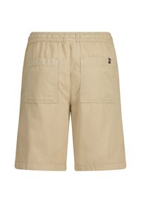 Beige shorts valmistettu kevyestä kankaasta, jossa on naru vyötäröllä, kaksi takataskua ja pieni brändilappu sivussa.