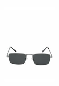 Lunettes de soleil à verres rectangulaires noirs avec une fine monture en métal argenté et des branches aux embouts noirs, présentées face avant sur fond blanc.