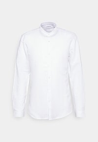 Camicia bianca a maniche lunghe in lino, con colletto a polo, chiusura frontale con bottoni e polsini aderenti. Design semplice, senza fantasie.