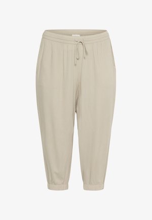 Beige tapered Jogginghosen mit einem elastischen Bund, verstellbarem Kordelzug und elastischen Bündchen. Hergestellt aus einem glatten, leichten Stoff.