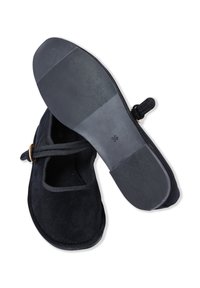 Black suede Mary Jane shoes with a round toe, adjustable strap, and rubber sole featuring a textured design. Size 39 marked on the sole.
