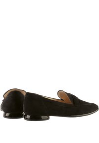 Black suede loafers with a pointed toe, featuring a folded design detail and a glossy black low heel. Smooth texture throughout.