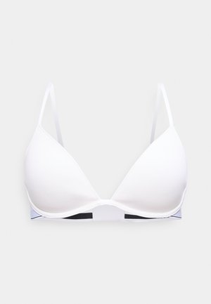 Sutien cu cupă albă modelată, cu bretele subțiri reglabile și o bandă netedă sub bust, având un model alb-negru.