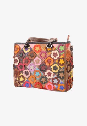 Patchwork leather handbag with colorful 3D flower appliqués in a grid pattern and black metal ring handles.