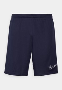 Pantalones cortos deportivos de color navy fabricados con tejido sintético, con una cintura elástica y un logo de Nike en blanco en la parte inferior de la pierna izquierda.