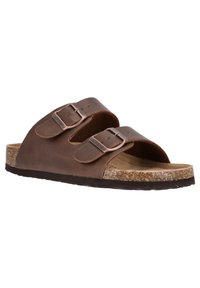 Sandales à glissière en cuir marron avec deux sangles réglables, boucles en métal et semelle intérieure en liège. Présente une semelle en caoutchouc texturée et un design minimal.