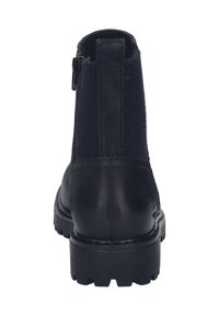 Botín negro con parte superior de cuero y fieltro, que presenta una cremallera lateral, puntera redondeada y suela de goma texturizada.