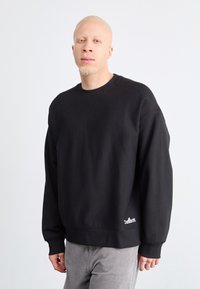 Carhartt WIP - LABEL SCRIPT  - Sweatshirt - black Miniaturebillede 1