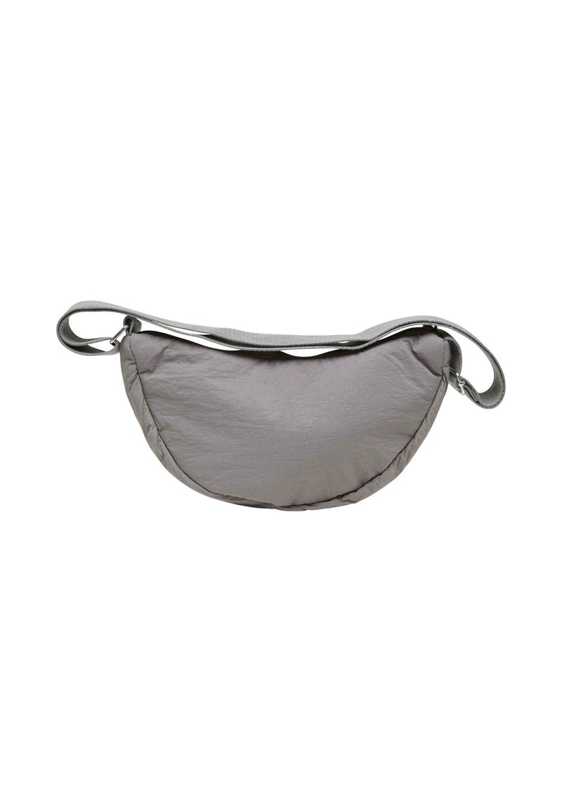 Gray, padded sling bag with a curved shape, made from lightweight material. Features a simple strap and smooth texture.