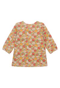 Blumige Tunika mit Dreiviertelärmeln, aus leichtem Material gefertigt. Mit pinkfarbenen, oran Färben und grünen Blumen auf einem cremefarbenen Hintergrund. Rundhalsausschnitt.