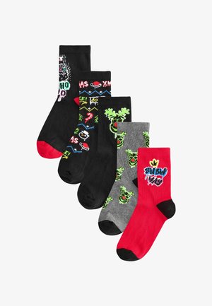 Five pairs of socks: black with white and green graphics, red accents; grey with green reindeer; bright red with graphic text. Cotton blend material.