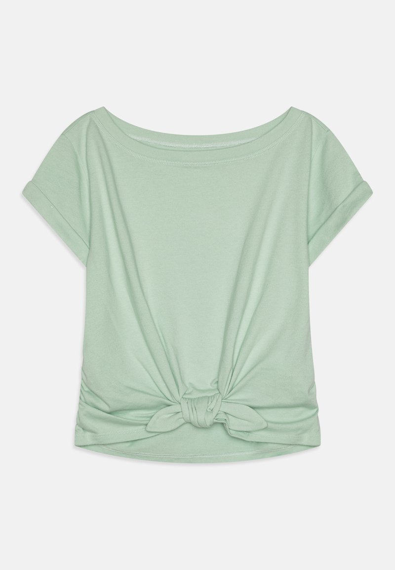 Μιντ πρασινί T-shirt με κοντά μανίκια, σε χαλαρή γραμμή και με λεπτομέρεια κόμπου στο κάτω μέρος. Φτιαγμένο από μαλακό και λείο ύφασμα με στρογγυλή λαιμόκοψη.