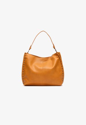 Tan leather hobo bag with rounded shape, studded accents along one side, and a single shoulder strap. Smooth texture with minimal seams.