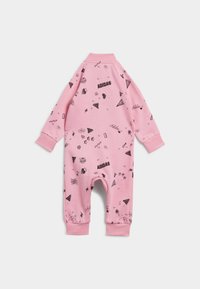 Pink toddler onesie featuring black printed graphics, long sleeves, and ribbed cuffs. Material appears soft and stretchy, designed for comfort.