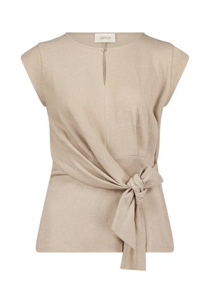 Beige short-sleeve blouse with keyhole neckline button, fabric knot tied at waist, and subtle shimmer texture.