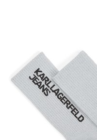 Šedé rebrované ponožky s čiernym logom "KARL LAGERFELD JEANS", s textúrovaným dizajnom a stredne elastickým materiálom.
