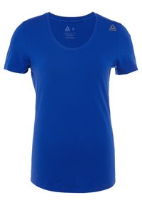 Camiseta atlética azul de manga corta, hecha de tejido suave. Cuenta con un cuello redondeado y una etiqueta con el logo de Reebok en el hombro izquierdo. Talla S.