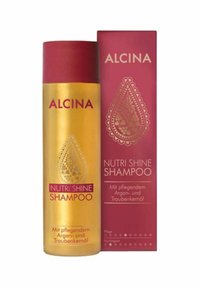 Gold bottle of Alcina Nutri Shine Shampoo, with maroon cap and label. Packaging features intricate teardrop pattern and white text details.