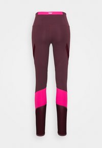Mörklila träningsleggings med ljusrosa detaljer på midjebandet och nedre benen, med en åtsittande design och varumärkeslogotyp på midjebandet.
