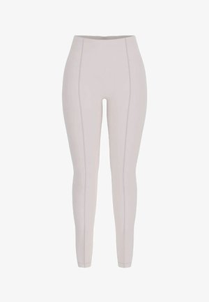Leggings aderenti a vita alta di colore grigio chiaro con dettagli di cuciture verticali sulla parte anteriore e una fascia elastica liscia in vita.